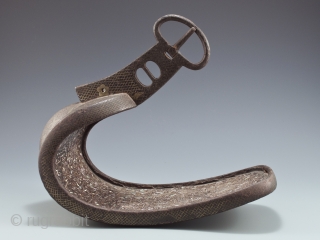 Abumi (samurai stirrup),
Japan.
Iron, mother of pearl, silver, bronze,
11" (28 cm)  long by 10" (25.4 cm) high by 5" (12.2 cm) wide,
Edo Period          