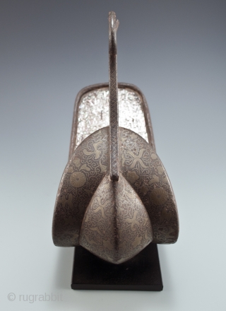 Abumi (samurai stirrup),
Japan.
Iron, mother of pearl, silver, bronze,
11" (28 cm)  long by 10" (25.4 cm) high by 5" (12.2 cm) wide,
Edo Period          