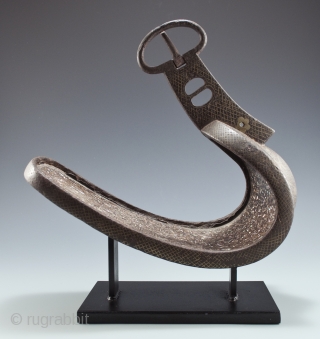 Abumi (samurai stirrup),
Japan.
Iron, mother of pearl, silver, bronze,
11" (28 cm)  long by 10" (25.4 cm) high by 5" (12.2 cm) wide,
Edo Period          