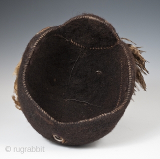 Emedot Headdress,
Karamojong tribe, Uganda/Kenya.
Feathers, felted human hair, clay, wire, aluminum rings,
20th century.
8.5" (21.6 cm) high by 7.5" (19 cm) wide by 6.5" 16.5 cm) deep
Ex. Merton D. Simpson
Catalog notes: "Amoung a selection  ...