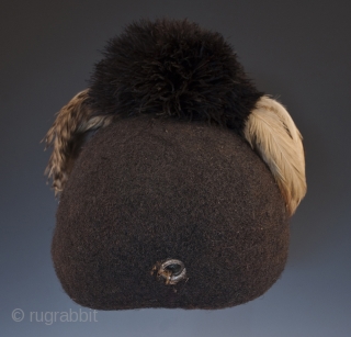 Emedot Headdress,
Karamojong tribe, Uganda/Kenya.
Feathers, felted human hair, clay, wire, aluminum rings,
20th century.
8.5" (21.6 cm) high by 7.5" (19 cm) wide by 6.5" 16.5 cm) deep
Ex. Merton D. Simpson
Catalog notes: "Amoung a selection  ...