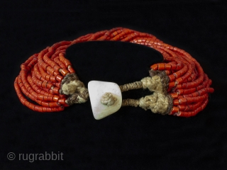 A festive red beaded necklace, Naga people, Nagaland, Northeastern India. Trade beads, shell, string, early to mid-20th century, 20" (58.8 cm) inner circumference.


          