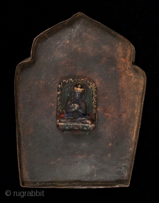Gau prayer box, Tibet, with a small ceramic figure on the inside of the back panel. It can be seen through the glass window. These were worn while traveling or kept in  ...