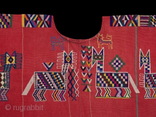 Huipil (blouse),
Chajul village, Guatemala.
Cotton,
1970s,
32" (80 cm) wide by 23.5" 60 cm) high.
Ex. private San Francisco collection.

Handspun and backstrap loomed cotton make Chajul huipiles strong and sturdy because while weaving the women stand  ...