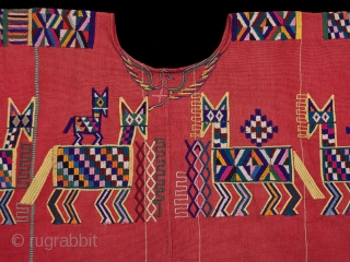 Huipil (blouse),
Chajul village, Guatemala.
Cotton,
1970s,
32" (80 cm) wide by 23.5" 60 cm) high.
Ex. private San Francisco collection.

Handspun and backstrap loomed cotton make Chajul huipiles strong and sturdy because while weaving the women stand  ...