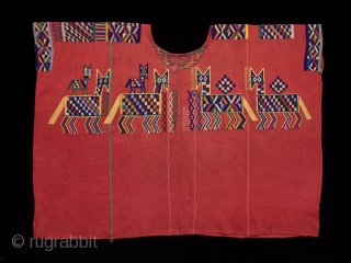 Huipil (blouse),
Chajul village, Guatemala.
Cotton,
1970s,
32" (80 cm) wide by 23.5" 60 cm) high.
Ex. private San Francisco collection.

Handspun and backstrap loomed cotton make Chajul huipiles strong and sturdy because while weaving the women stand  ...