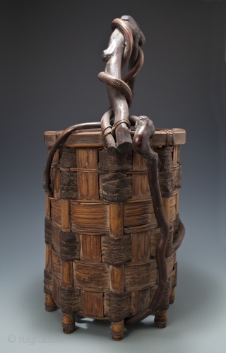 Ikebana basket,
Japan.
Split bamboo, mulberry bark, twisted branch and vine.
Showa Period,
20.5" (52 cm) high by 11" (28 cm) wide               