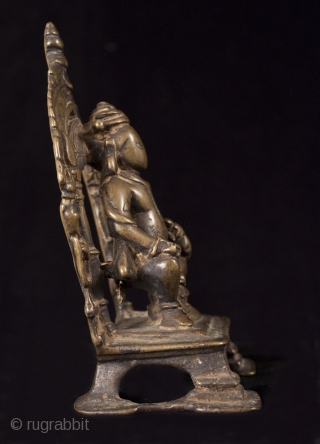 Kubera, India.
Lost wax cast bronze.
5 1/2" (14 cm) high.
13-16th century.

This is a small portable bronze shrine of Kubera, the god of riches and guardian of the north. He is short and portly  ...