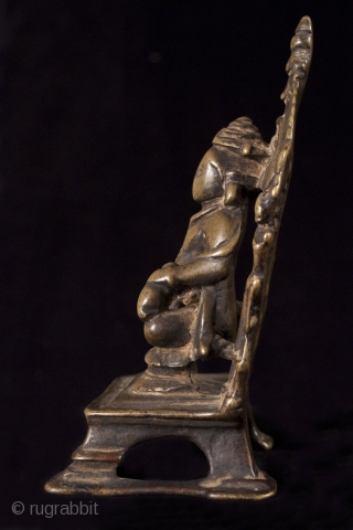 Kubera, India.
Lost wax cast bronze.
5 1/2" (14 cm) high.
13-16th century.

This is a small portable bronze shrine of Kubera, the god of riches and guardian of the north. He is short and portly  ...