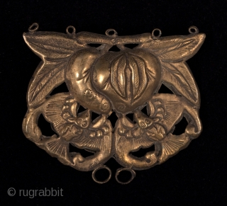 Peach pendant with bats, China. Brass repousse.
2.5" (6.5 cm) wide by 2" (5 cm) high.
Early to mid-20th century.

In Chinese lore, peaches symbolize a long and healthy life, while bats represent happiness and  ...