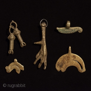 Pendants, West Africa. Bronze and brass alloy. Early to mid-20th century
#3574a   Skeins of rope goldweight 2" (5 cm)   $75
#3574b   Bird foot 3 1/2" (9 cm)   ...
