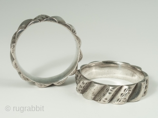 Silver Bracelets, Aït Atta people, Morocco, 7.5 inches (19 cm) inner circumference, .75 inches high, 308 grams total. Late 19th to early 20th century.
This very wearable pair of twelve point silver bracelets  ...