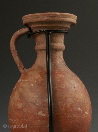 Antique Roman Vase with Stand

Red clay Roman pottery vessel with handle, flanged lip over curved body, worn white design, most likely a wine ewer, display stand.

Provenance Handley Collection 

Date 300 AD 

Size  ...