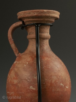 Antique Roman Vase with Stand

Red clay Roman pottery vessel with handle, flanged lip over curved body, worn white design, most likely a wine ewer, display stand.

Provenance Handley Collection 

Date 300 AD 

Size  ...