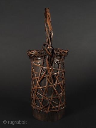 Japanese Antique Bamboo Flower Basket

Japanese antique bamboo flower basket, cylindrical shaped with open weave with a criss cross design. Body open to expose bamboo container. Handle has twisted bamboo strands attached at  ...