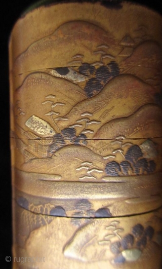 Antique Japanese Gold Landscape Inro
Japanese gold lacquer inro with five compartments, decorated in low relief landscape scene of lakeside mountains, cottages, pagodas, pine trees, and bridges in gold lacquer and accents of  ...