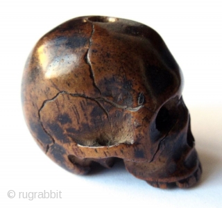 Unusual Antique Japanese Boxwood Skull Ojime
Japanese boxwood ojime bead carving of a skull, finely detailed with realistic cranial fissures, charming missing teeth, pierced eye sockets and nasal cavity, with tiny handmade chisel  ...