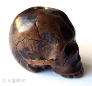 Unusual Antique Japanese Boxwood Skull Ojime
Japanese boxwood ojime bead carving of a skull, finely detailed with realistic cranial fissures, charming missing teeth, pierced eye sockets and nasal cavity, with tiny handmade chisel  ...