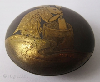 Charming 18th C. Japanese Lacquer Kogo with Rabbit Pounding Mochi
A round Japanese kogo or incense box with sprinkled gold lacquer maki-e motif of an anthropomorphic rabbit pounding mochi. The rabbit wears a  ...