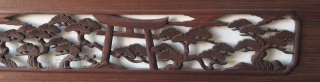 Antique Japanese Ranma (transom)
Antique Japanese wood ranma (transom) with a black lacquer frame. The center panel carved with a Shinto gate (torii) and temple lantern in a forest of pine trees. 

Dimensions:  ...