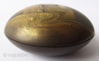 Charming 18th C. Japanese Lacquer Kogo with Rabbit Pounding Mochi
A round Japanese kogo or incense box with sprinkled gold lacquer maki-e motif of an anthropomorphic rabbit pounding mochi. The rabbit wears a  ...