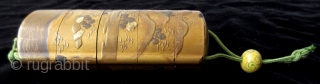 Antique Japanese Gold Landscape Inro
Japanese gold lacquer inro with five compartments, decorated in low relief landscape scene of lakeside mountains, cottages, pagodas, pine trees, and bridges in gold lacquer and accents of  ...