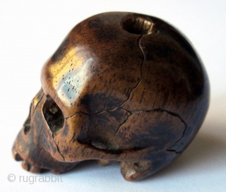 Unusual Antique Japanese Boxwood Skull Ojime
Japanese boxwood ojime bead carving of a skull, finely detailed with realistic cranial fissures, charming missing teeth, pierced eye sockets and nasal cavity, with tiny handmade chisel  ...