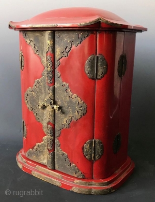 Japanese Red Lacquer Zushi Traveling Buddhist Shrine
Japanese Buddhist Zushi (portable shrine) with bright red lacquered wood exterior and gilt interior. Shrine with the statue of sitting Fudo Myoo, the fierce deity with  ...