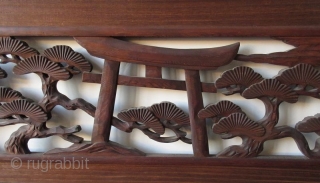 Antique Japanese Ranma (transom)
Antique Japanese wood ranma (transom) with a black lacquer frame. The center panel carved with a Shinto gate (torii) and temple lantern in a forest of pine trees. 

Dimensions:  ...