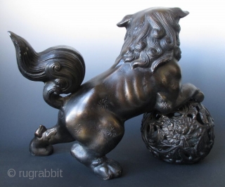 Playful Japanese Bronze Fu-dog on Ball
Japanese bronze fu-dog and ball. The playful fu-dog stands with mouth open in a dynamic pose with back feet on the ground and front paws on the  ...