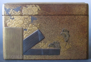 Japanese Antique Gilt Lacquer Kobako with Inside Tray
Antique Japanese small kobako (incense box) with inside tray. The outside is decorated with a scene of a garden fence, chrysanthemums, hydrangeas and daisies in  ...