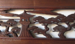 Antique Japanese Ranma (transom)
Antique Japanese wood ranma (transom) with a black lacquer frame. The center panel carved with a Shinto gate (torii) and temple lantern in a forest of pine trees. 

Dimensions:  ...