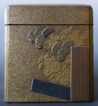 Japanese Antique Gilt Lacquer Kobako with Inside Tray
Antique Japanese small kobako (incense box) with inside tray. The outside is decorated with a scene of a garden fence, chrysanthemums, hydrangeas and daisies in  ...