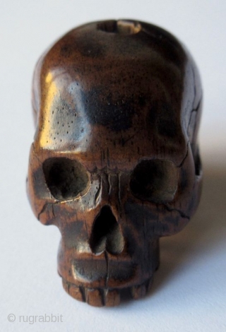 Unusual Antique Japanese Boxwood Skull Ojime
Japanese boxwood ojime bead carving of a skull, finely detailed with realistic cranial fissures, charming missing teeth, pierced eye sockets and nasal cavity, with tiny handmade chisel  ...