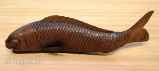 Antique Japanese Carved Okimono of Swimming Carp

Antique Japanese boxwood okimono of swimming carp fish with sinuously shaped body and realistically carved scales and details. Lovely soft patina of golden brown color. Good  ...