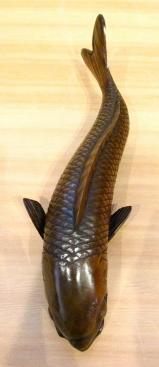 Antique Japanese Carved Okimono of Swimming Carp

Antique Japanese boxwood okimono of swimming carp fish with sinuously shaped body and realistically carved scales and details. Lovely soft patina of golden brown color. Good  ...