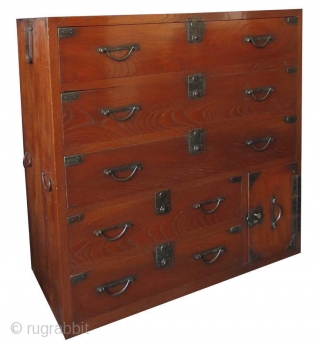 Antique Japanese Keyaki Front Tansu


Unusual Japanese single section isho tansu (clothing chest), with dramatic Keyaki (elm) front drawers, opened by simplistic hirute style handle pulls and small, squared locks. Its bottom safe  ...