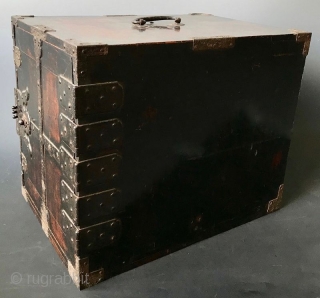 Antique Japanese Lacquered Fune Bako
Japanese dark lacquered fune bake, or ship safe box with heavy hand-forged iron hardware and plates. The interior of the box holds six small drawers opened by kan  ...