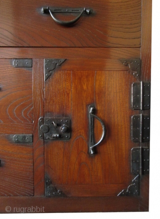 Antique Japanese Keyaki Front Tansu


Unusual Japanese single section isho tansu (clothing chest), with dramatic Keyaki (elm) front drawers, opened by simplistic hirute style handle pulls and small, squared locks. Its bottom safe  ...