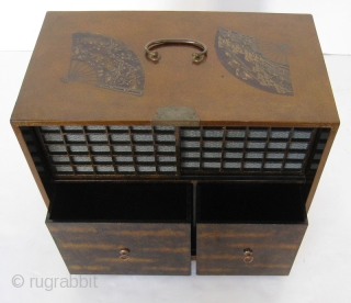 Stunning Antique Japanese Lacquered Case

Beautiful Japanese light colored gold guilt lacquered case with fans. There are six fans with cranes, landscape scenes, and fruit. Original brass hardware has a lovely scrolling design.  ...