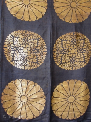 Japanese Antique Large Buddhist Textile Cover

Beautiful antique Japanese large covering originally used in a Buddhist temple. Three deep blue silk panels sewn together and woven with gold in design of 18 chrysanthemums  ...