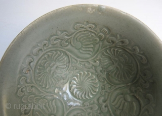 Antique Chinese Small Celadon Bowl


A small Chinese eggshell thin ceramic bowl with celadon green underglaze. The center of the bowl is incised with floral motifs and scrolls, and the outer edges are  ...