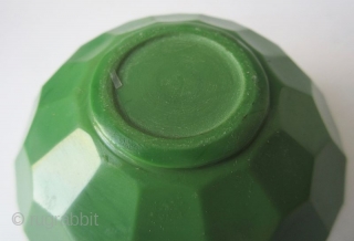 Antique Chinese Green Peking Glass Water Coupe

A stunning Chinese peking glass water coupe with faceted edges, in a monochrome emerald green color. The edges of the mouth have three ribbed steps down  ...