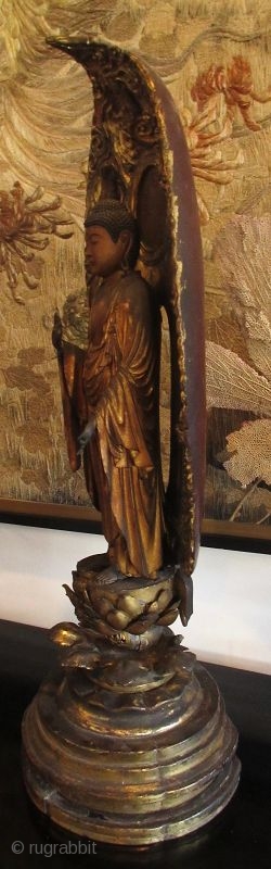 17th Century Japanese Standing Amida Buddha Statue

Stunning original 17th century Japanese Amida Buddha statue, gold gilt over wood with inlaid crystal on his third eye and his crown chakra. He stands on  ...