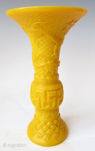 Antique Chinese Pair of Yellow Peking Glass Gu Vases

An elegant pair of Chinese monochrome yellow peking glass gu vases with relief carvings of waves, archaic scrolling serpents, one vase with a pair  ...