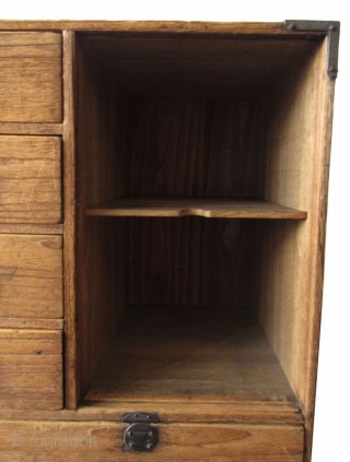 Antique Japanese Small Kiri Tansu

Unusual Japanese Kiri (paulownia) tansu with 8 drawers and a lift away panel opening to a shelved interior with spacious room. The 8 front drawers feature small round  ...