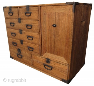 Antique Japanese Small Kiri Tansu

Unusual Japanese Kiri (paulownia) tansu with 8 drawers and a lift away panel opening to a shelved interior with spacious room. The 8 front drawers feature small round  ...