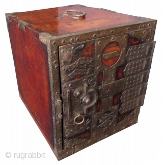 Antique Japanese Keyaki Fune Bako

Antique Japanese solid Keyaki (zelkova) hardwood fune bako or ship safe box. The front of the box has heavy iron plating with the number one (ichi) within a  ...