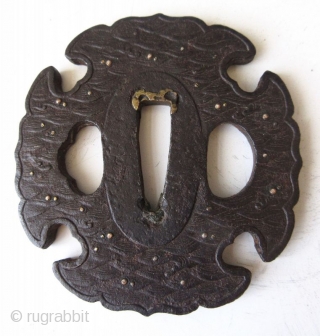 Antique Japanese Iron Waves Tsuba

Japanese iron tsuba, or hand guard for a samurai's sword, with cast motifs of waves inlaid with gold and silver, the patina indicates age and wear from use.  ...