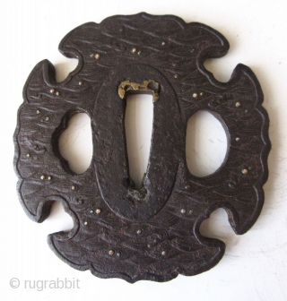 Antique Japanese Iron Waves Tsuba

Japanese iron tsuba, or hand guard for a samurai's sword, with cast motifs of waves inlaid with gold and silver, the patina indicates age and wear from use.  ...